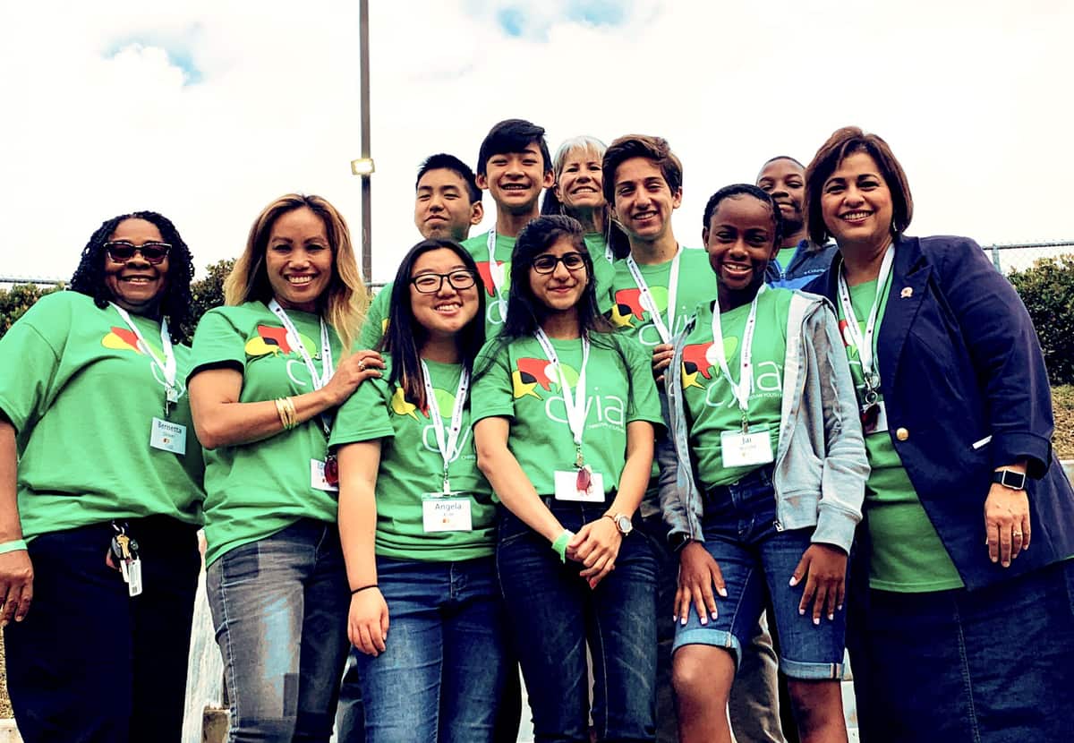 CYIA students and leaders in matching green shirts