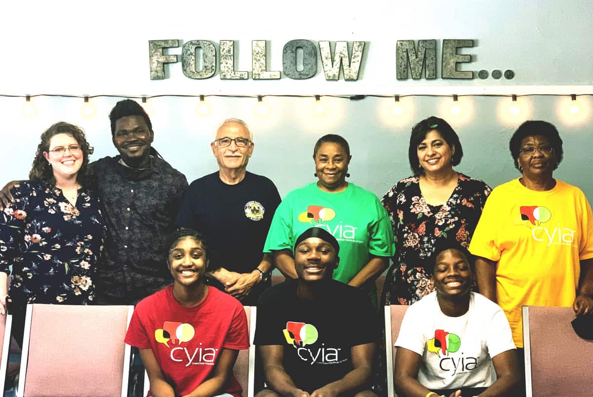 CYIA team and CEF Pasadena leaders under a Follow Me sign